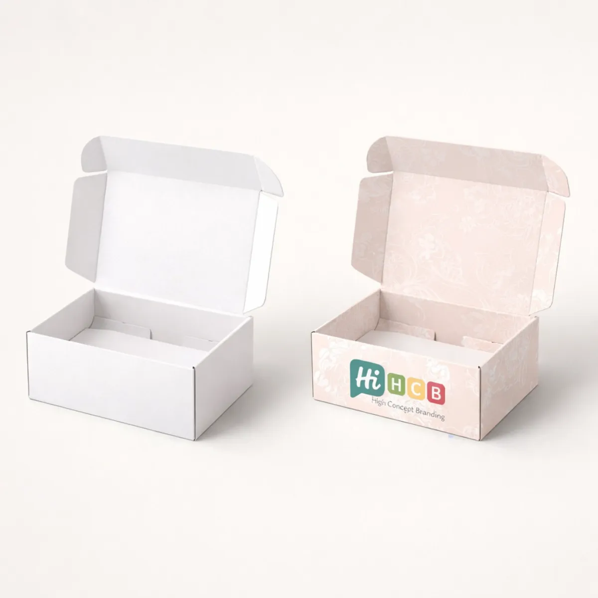 Open corrugated mailer boxes for shipping- presented in basic white and a bespoke pink floral print- class=